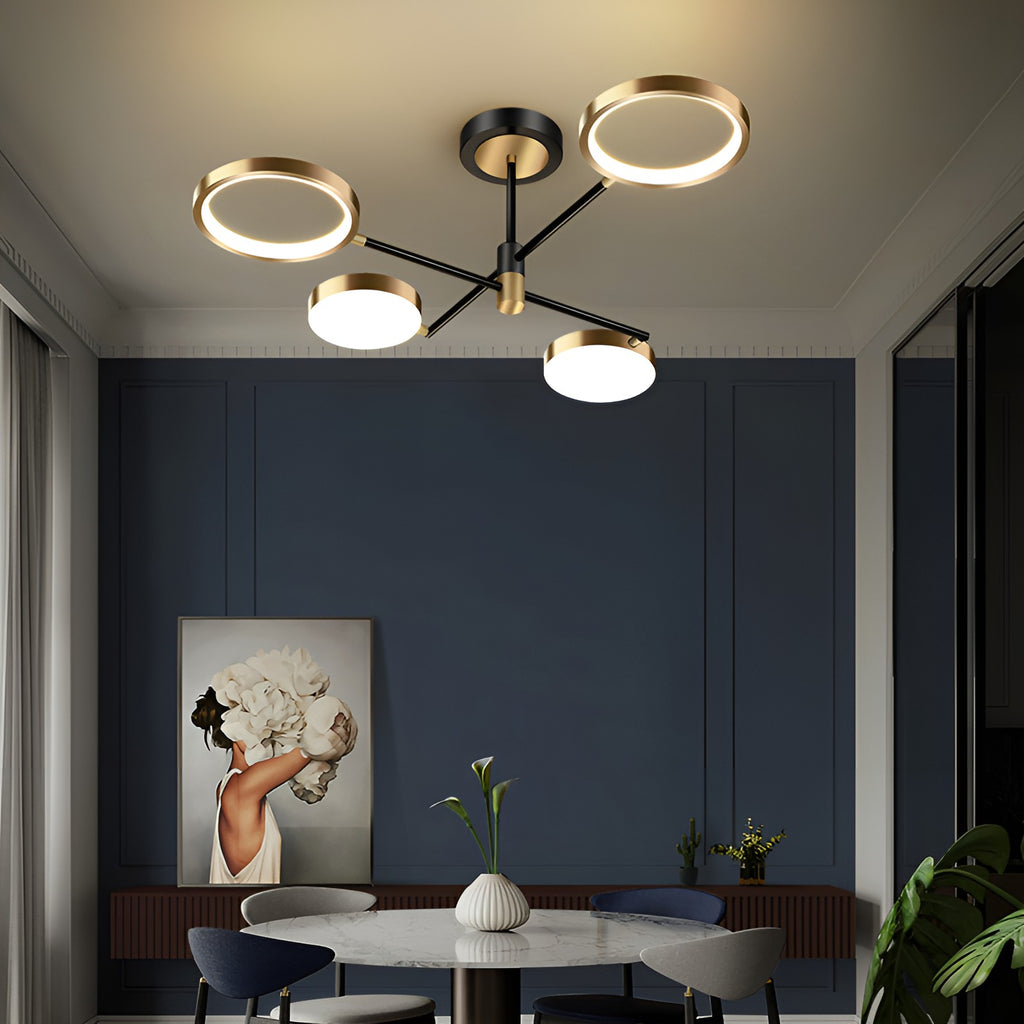 Modern black and gold LED ceiling chandelier with ring lights above a dining table