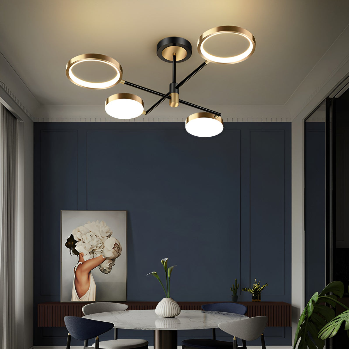 Modern black and gold LED ceiling chandelier with ring lights above a dining table