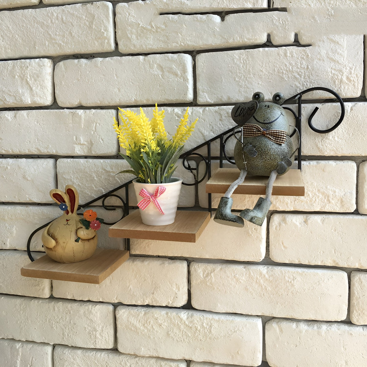 Rustic wrought iron stair-step wall shelf with three wood shelves on a white brick wall